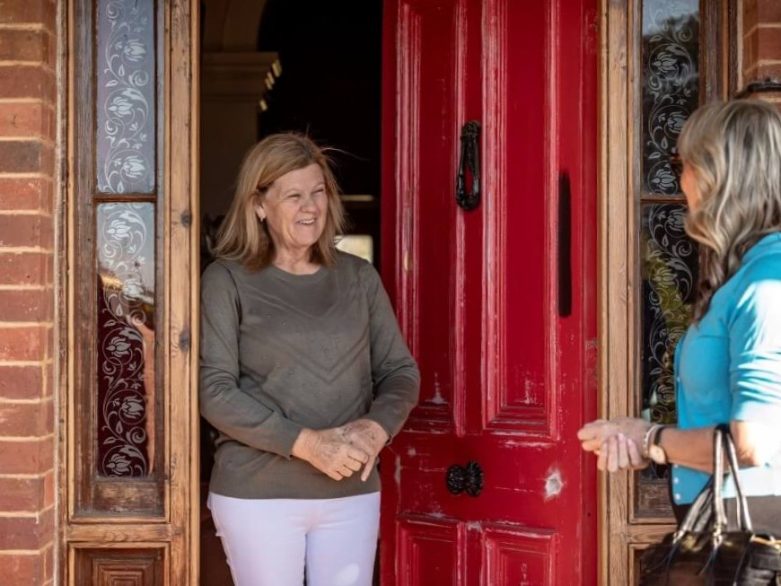 conveyancing-property-law-buy-and-sell-property-client-standing-in-doorway-sarah-byrne-law_4x3_1000px.jpg